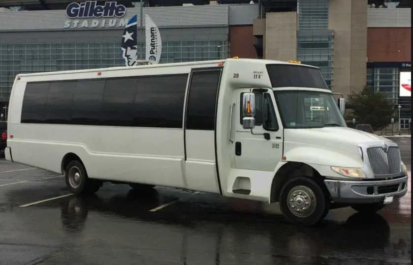 Black Mini Coach for mini coach rental in Dover, MA