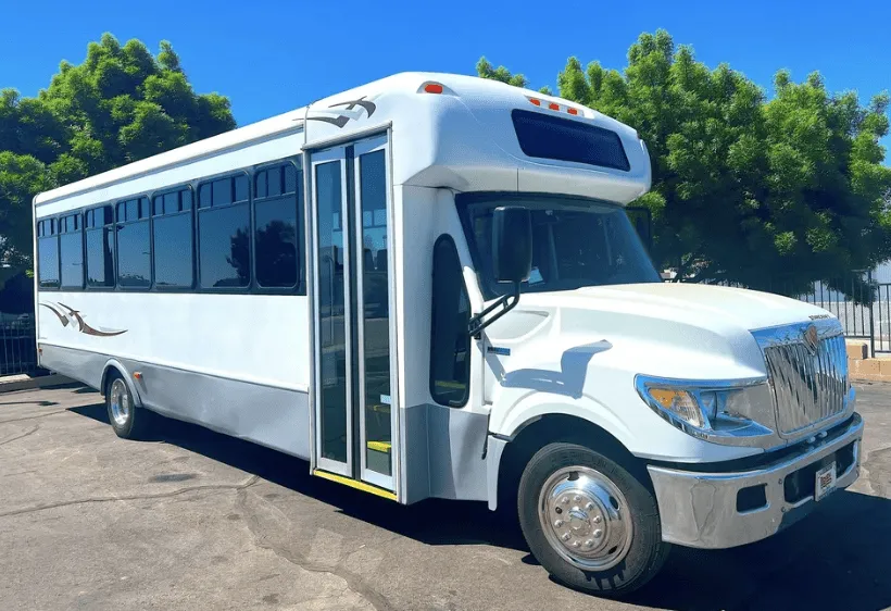 White 28 Passenger Mini Coach for shuttle bus rental in Fresno County, CA