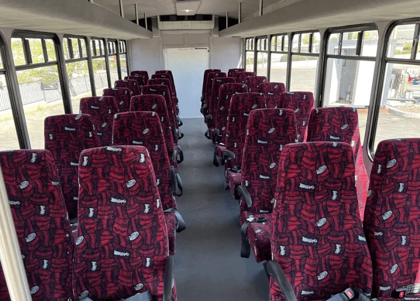 28 Passenger Mini Coach interior for shuttle bus rental in Fresno County, CA