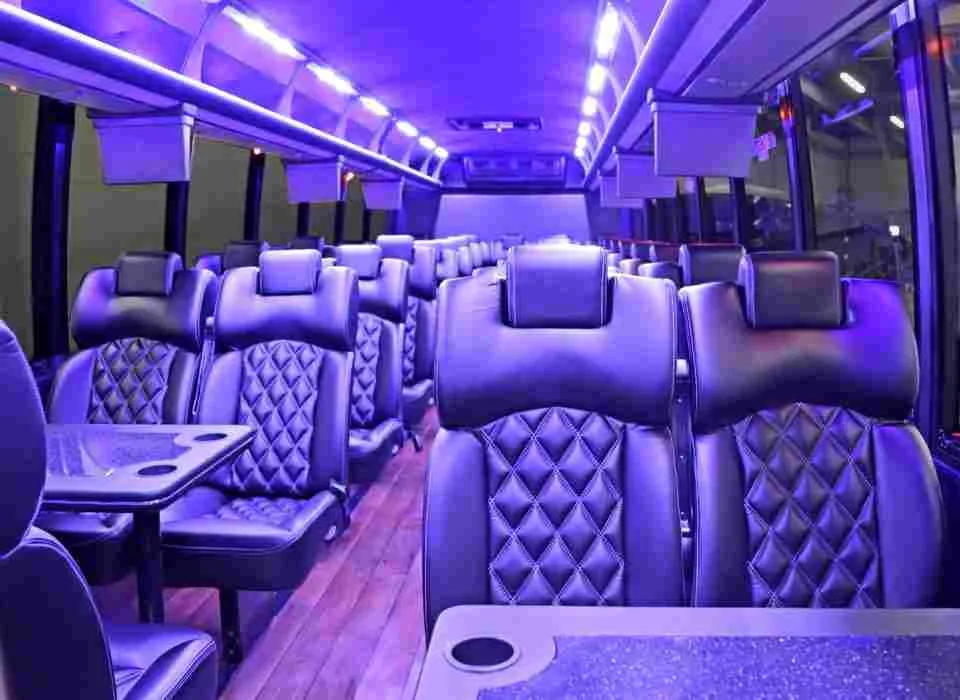40 Passenger Mini Coach interior with passenger tables, cup holders and LED ceiling lighting for minibus rental 40 Passenger Mini Coach interior with passenger tables, cup holders and LED ceiling lighting for minibus rental