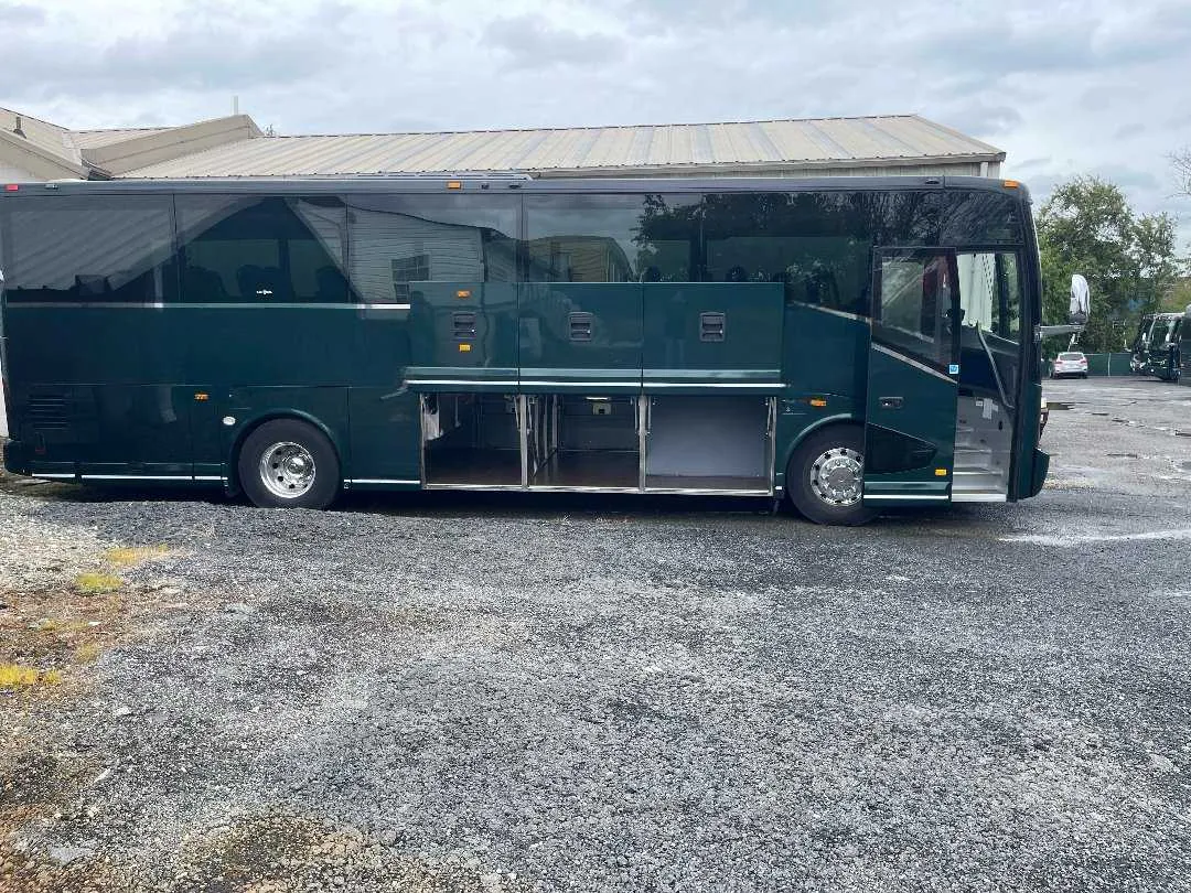 38 Passenger Mini Coach exterior with tinted windows and under-floor luggage bays for minibus rental