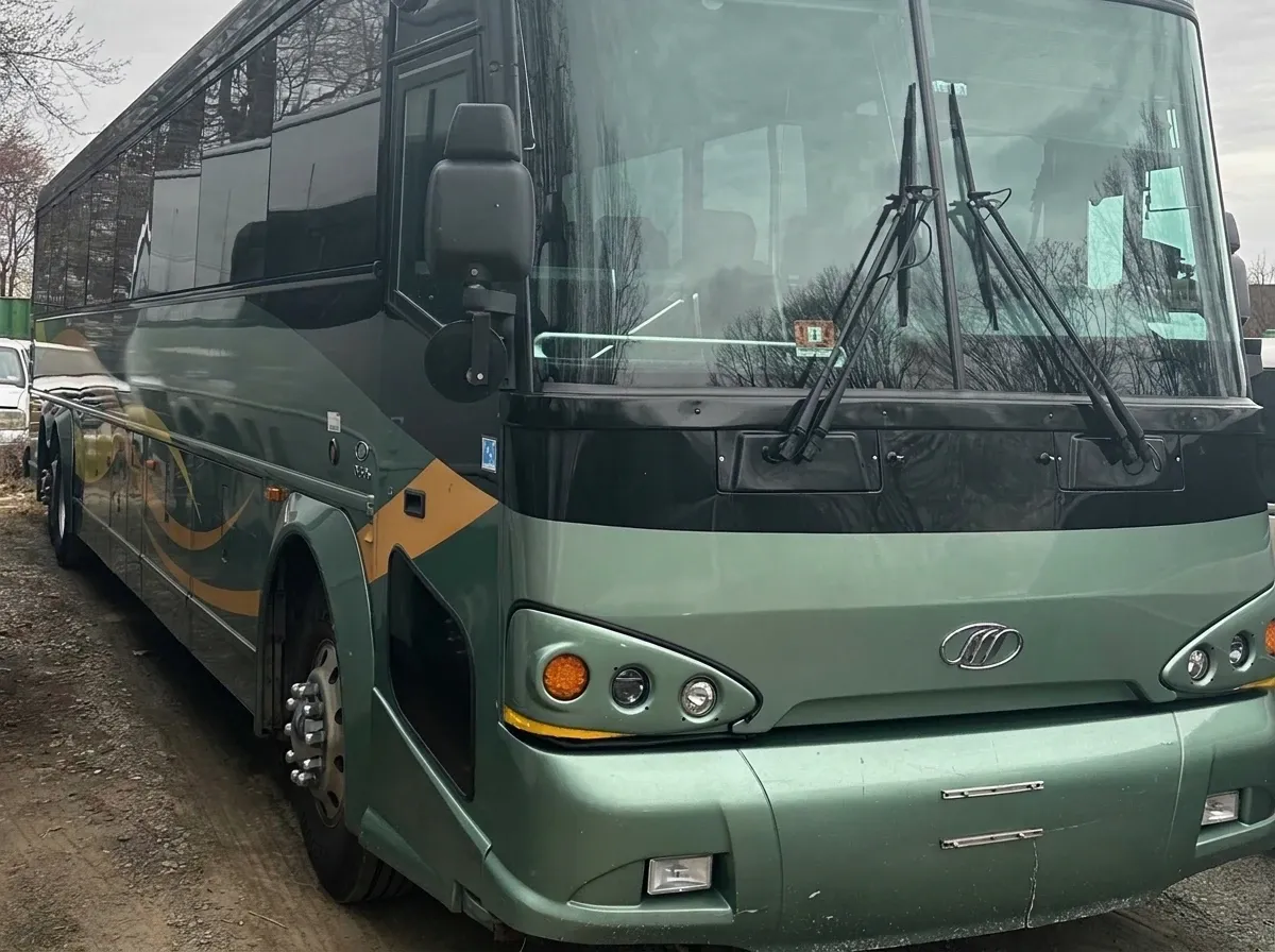 Green 55 Passenger Motor Coach for charter bus rental Green 55 Passenger Motor Coach for charter bus rental