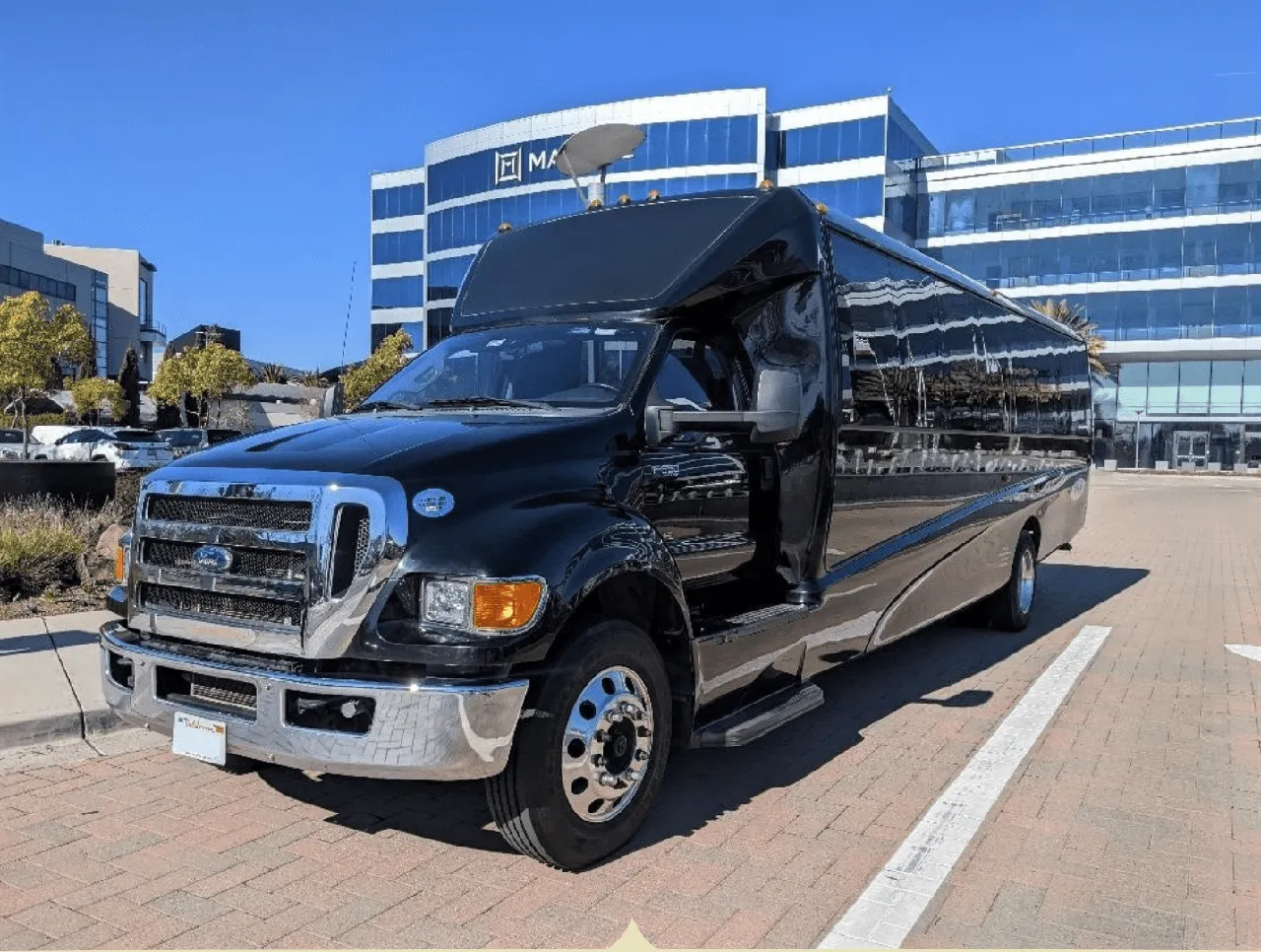 Black Ford F550 Executive Mini Coach with tinted windows for minibus rental Black Ford F550 Executive Mini Coach with tinted windows for minibus rental