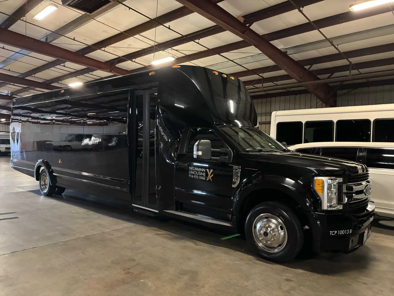 Black Party Bus exterior for party bus rental in Mather, CA