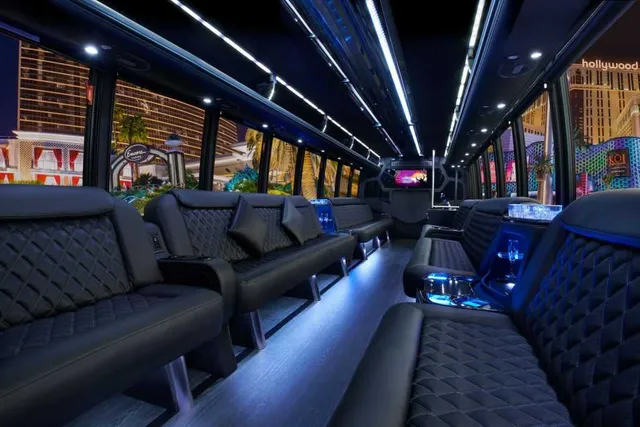 30 Passenger Party Bus interior with perimeter lounge seating, LED accent lighting and LED ceiling lighting for party bus rental in Dallas, TX 30 Passenger Party Bus interior with perimeter lounge seating, LED accent lighting and LED ceiling lighting for party bus rental in Dallas, TX