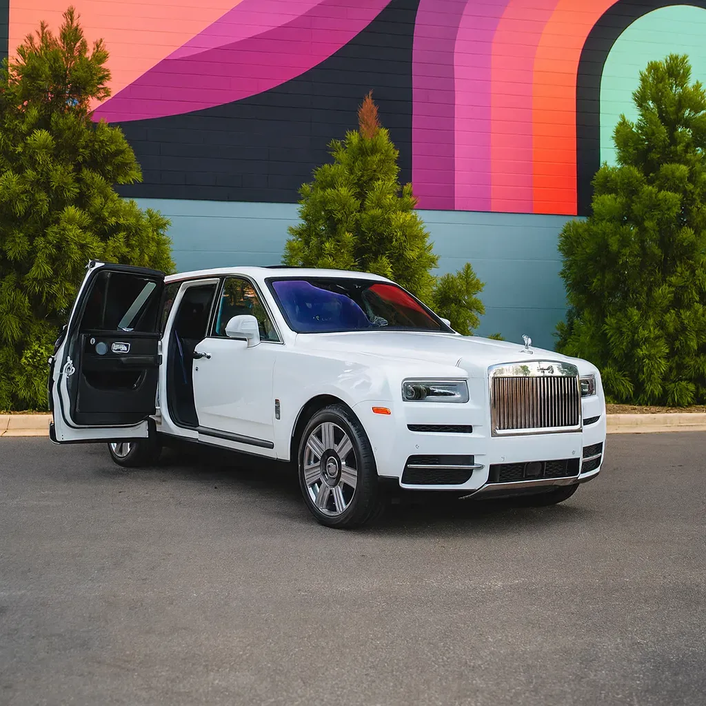 White Rolls-Royce Cullinan with All Black Interior for airport transfers White Rolls-Royce Cullinan with All Black Interior for airport transfers
