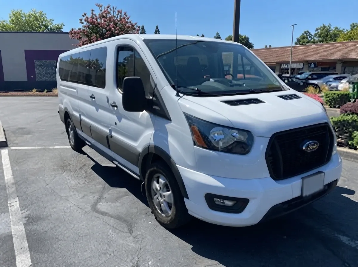 White 10 Passenger Transit Van for minibus rental White 10 Passenger Transit Van for minibus rental
