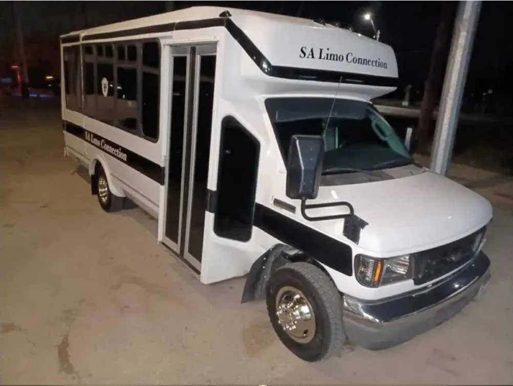 White Tuxedo Party Bus exterior, photo 3 for party bus rental in Buda, TX