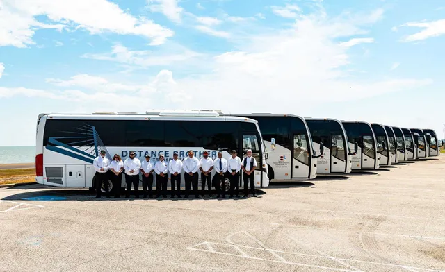 ADA Coach exterior with tinted windows for charter bus rental in Agua Dulce, TX