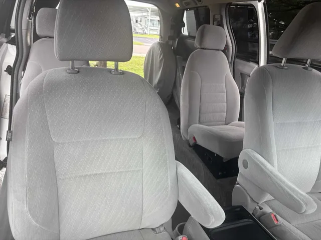 Wheelchair Accessible Van interior with captain's chairs for mini coach rental in Branch, MI