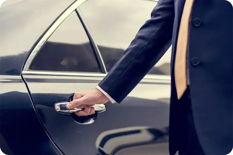 Chauffeur opening the car door